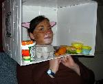 She is in your fridge, eating your foods.